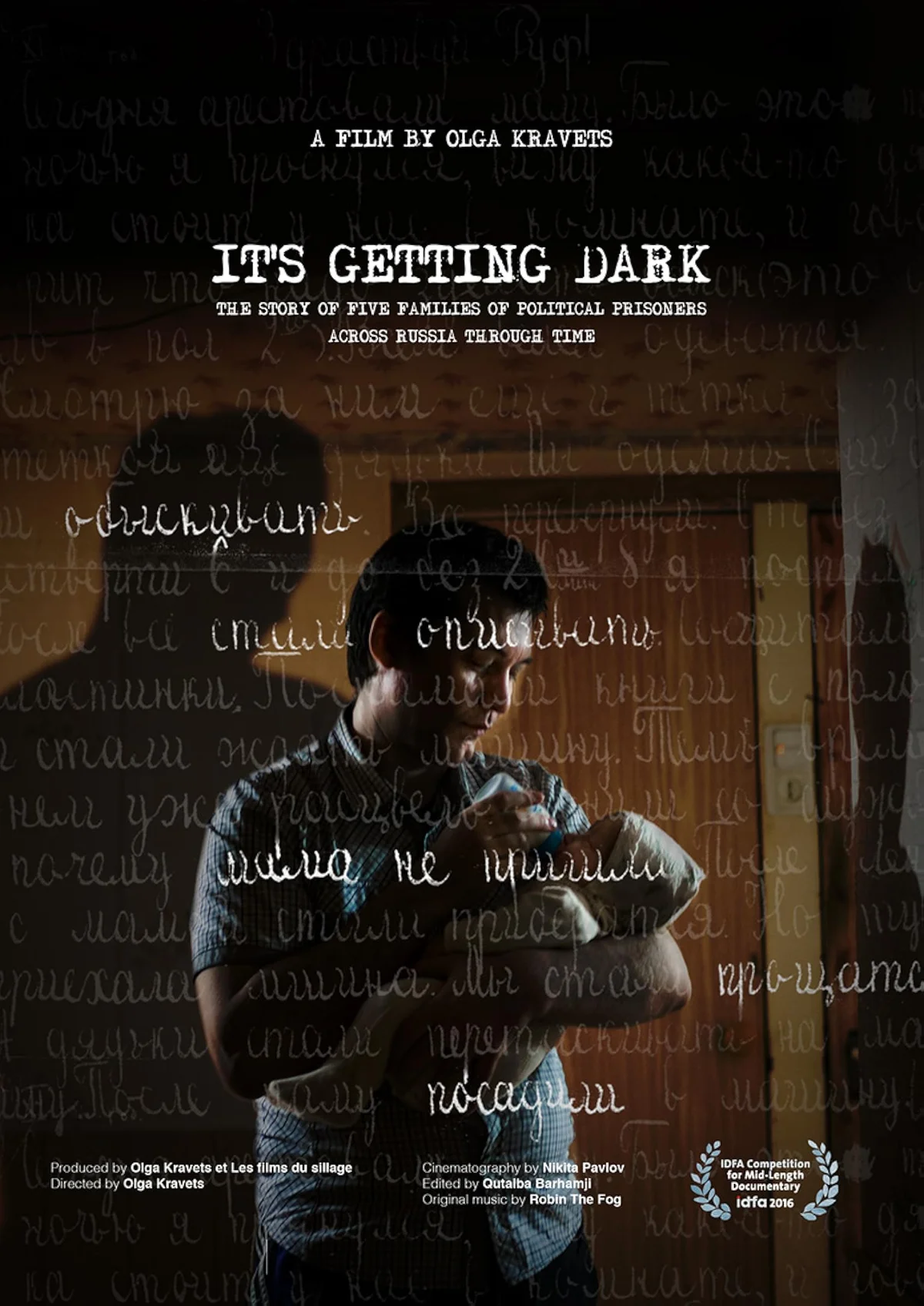 The poster of the documentary film It's Getting Dark, showing a Russian man holding his baby.